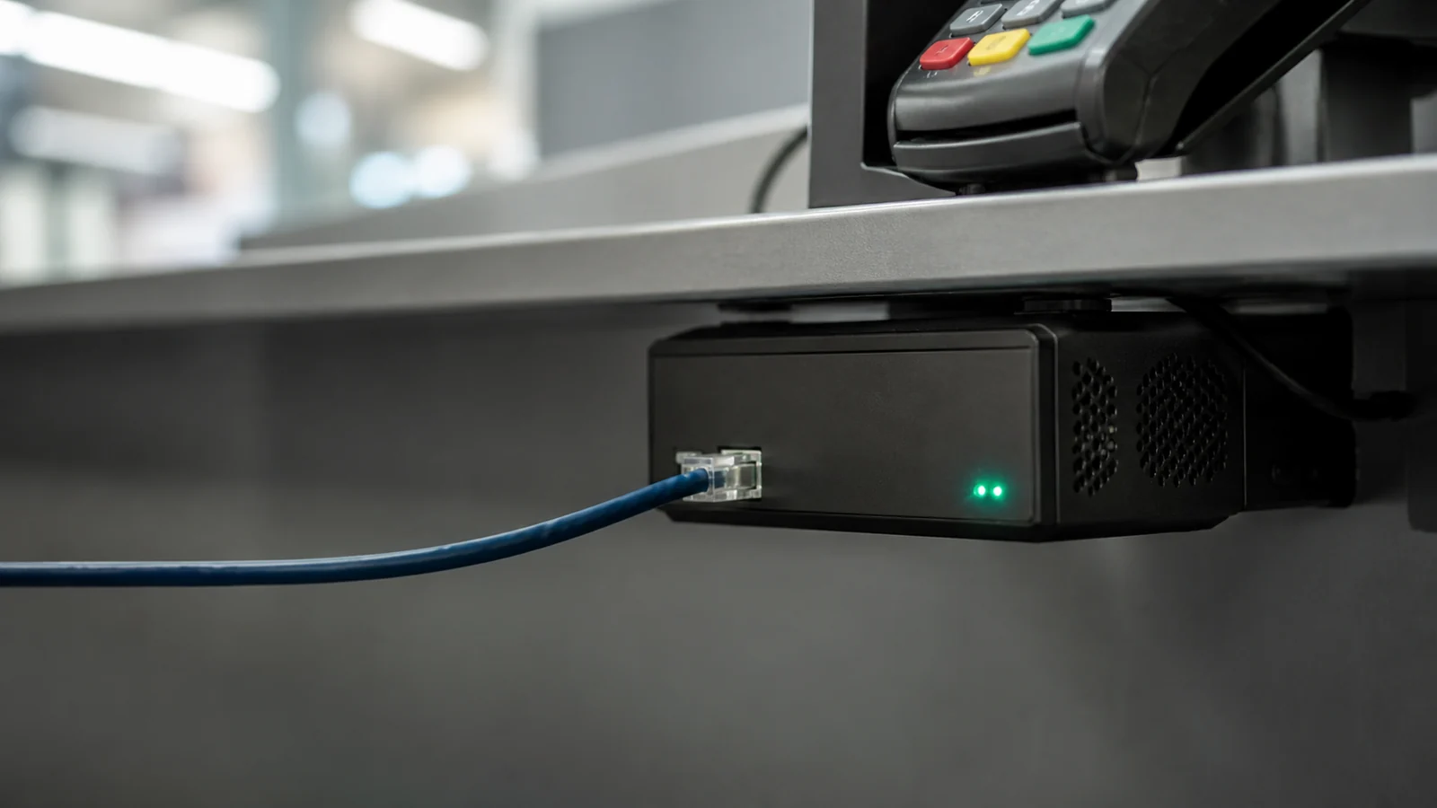 A rogue network device connected beneath a retail payment terminal while transaction lights spread toward a financial switch